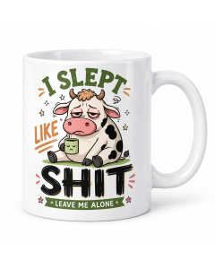 Funny rude I Slept Like Shit cow mug shown on a clean white background.