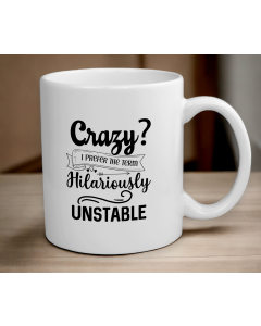 Funny hilariously unstable quote mug on wooden table