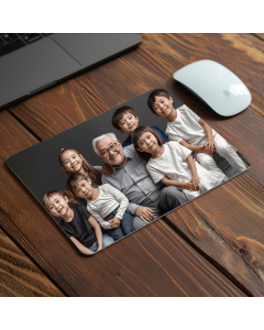 Personalised photo mouse pad with family image on wooden desk beside laptop and mouse