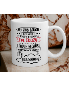 Funny hereditary parent quote mug on marble background