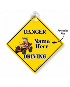 Personalised Danger Name Driving car sign with yellow diamond warning design, cartoon driver and suction cup on white background
